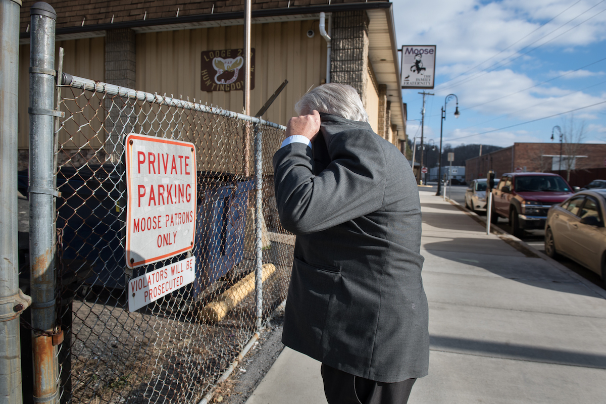 David Riehl Fisher, 64, of Alexandria, a former pastor at Shaver’s Creek Christian Fellowship in nearby Petersburg, hides from the camera as he leaves the sentencing hearing of church member Daniel R. Hostetler on Thursday, Nov. 29, 2018, in Huntingdon. Fisher later pleaded no contest to a charge of endangering the welfare of children and received probation and a fine. According to a police criminal complaint, Fisher said he knew Mr. Hostetler sexually assaulted his own daughter when she was a minor and did not report it. Fisher admitted he told Hostetler if he sent his daughter to counseling in another state they’d get into trouble. (Stephanie Strasburg/Post-Gazette)