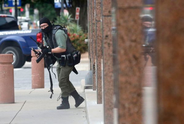 An armed shooter (shown) attacks at the Earle Cabell federal courthouse Monday morning in downtown Dallas. Law enforcement returned fire and the shooter was hit by gunfire. No officers or citizens were injured. FBI Special Agent in Charge Matthew DeSarno identified the shooter as Brian Isaack Clyde, 22 (Tom Fox/Staff photographer)