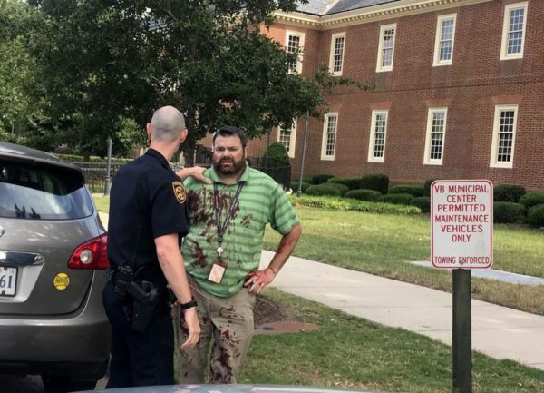 Photo: Alyssa Andrews Caption: Alyssa Andrews was parked on the side of the road waiting or her daughter near the shooting when she saw an unidentified man in a green shirt and khakis covered blood near the Virginia Beach Municipal Center on May 31, 2019.