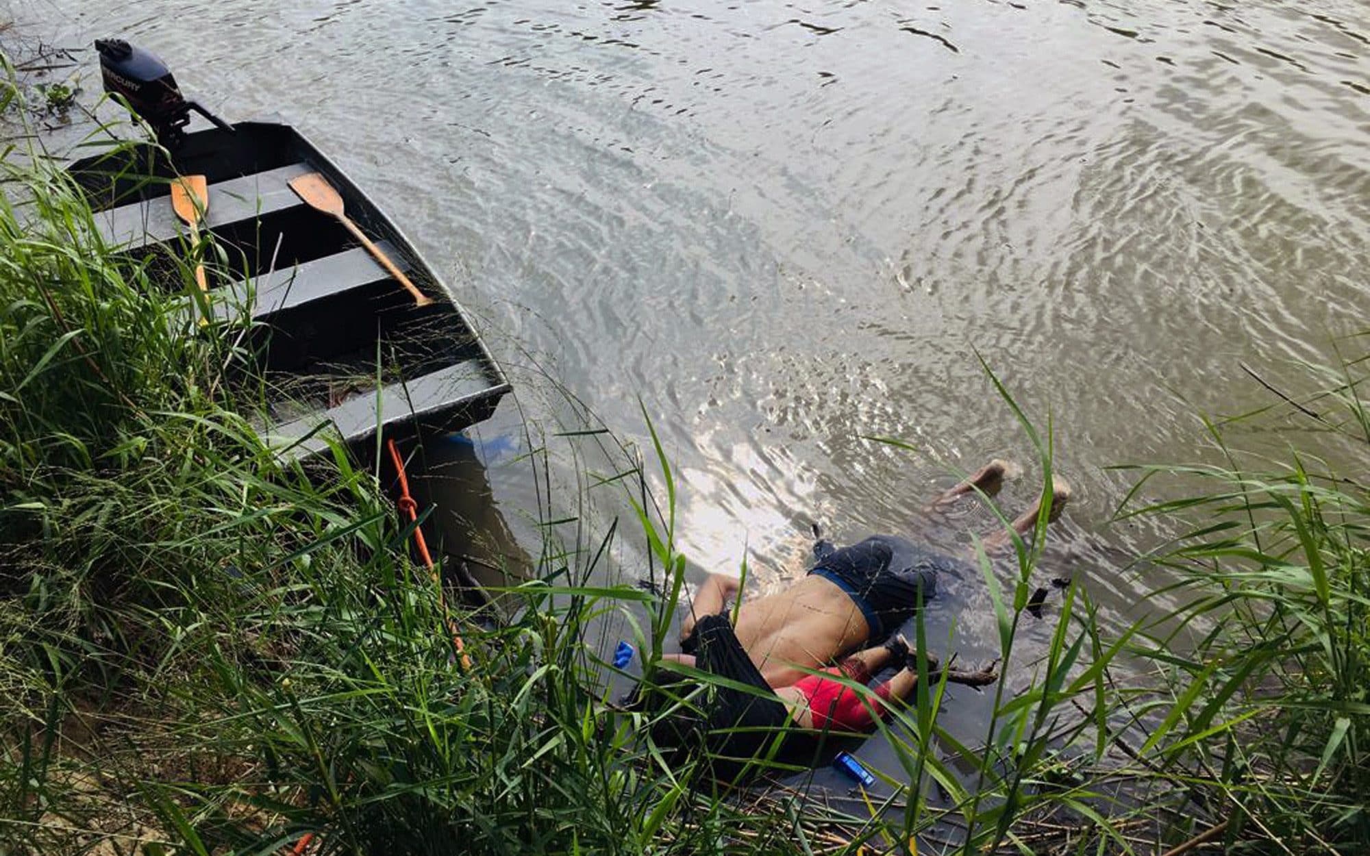 The bodies of Salvadoran migrant Oscar Alberto Martínez Ramírez and his nearly 2-year-old daughter Valeria lie on the bank of the Rio Grande in Matamoros, Mexico, Monday, June 24, 2019, after they drowned trying to cross the river to Brownsville, Texas. Martinez’s wife, Tania, told Mexican authorities she watched her husband and child disappear in the strong current. Julia Le Duc/AP