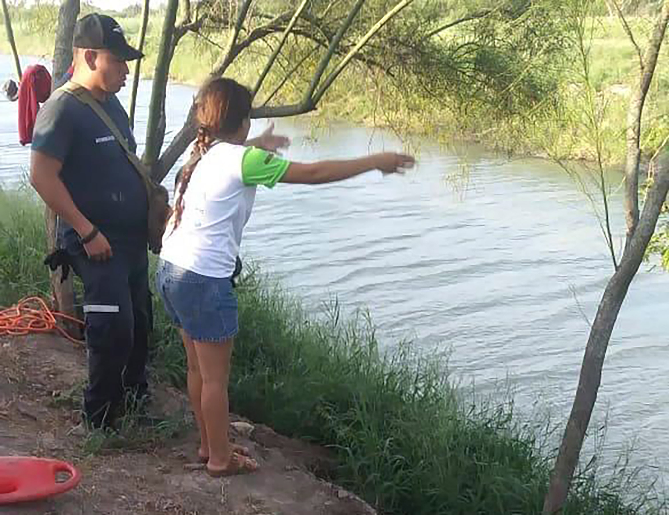 Mandatory Credit: Photo by Julia Le Duc/AP/Shutterstock (10321433b) Tania Vanessa Ávalos of El Salvador speaks with Mexican authorities after her husband and nearly two-year-old daughter were swept away by the current while trying to cross the Rio Grande to Brownsville, Texas, in Matamoros, Mexico. Their bodies, the toddler still tucked into her father's shirt with her arm loosely draped around him, were discovered Monday morning several hundred yards (meters) from where they had tried to cross US Border Migrant Deaths, Matamoros, Mexico - 23 Jun 2019