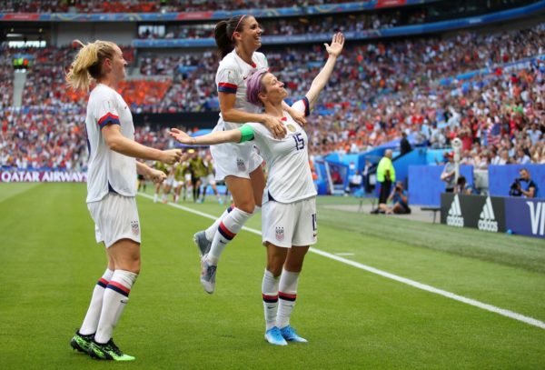 Megan Rapinoe of the USA celebrates with teammates Alex Morgan and Samantha Mewis after scoring her team’s first goal during the 2019 FIFA Women’s World Cup France Final match between The United States of America and The Netherlands at Stade de Lyon on July 07, 2019 in Lyon, France.Richard Heathcote/Getty Images