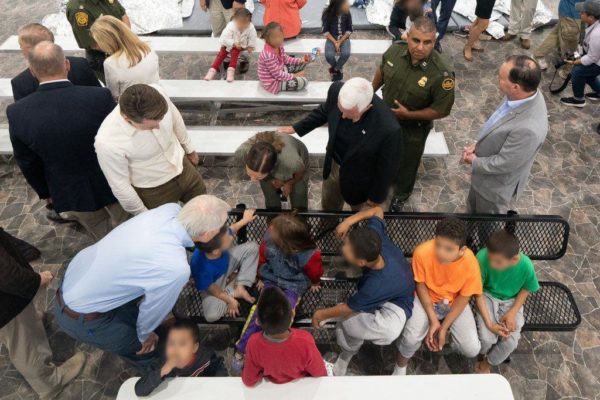 Vice President Mike Pence hovering, others from behind. Note GOP entourage all white males, except for Sen. Marsha Blackburn(top l) and omnipresent Second Lady Karen Pence in olive, who seems hard to differentiate in many pix from BP officer. (Photo: via VP Mike Pence)