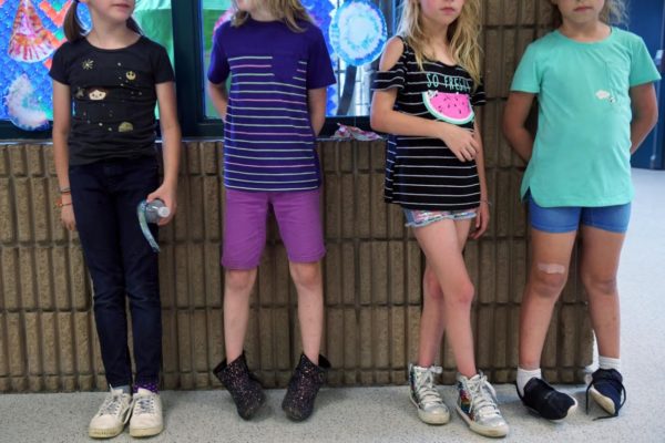 Photo: Amanda Voisard/Reuters. Keegan stands with his 3rd grade classmates at his elementary school.