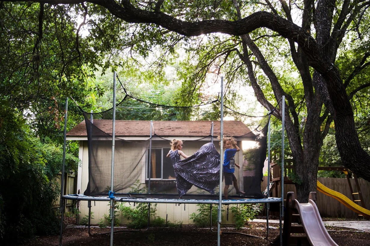 Photo: Amanda Voisard/Reuters. Keegan bounces on the trampoline with his brother Noah. 