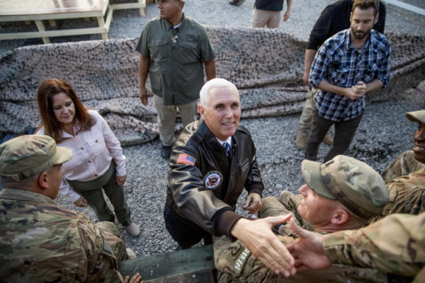 Photo: Andrew Harnik/AP. Caption: Vice President Mike Pence and his wife Karen Pence greets troops at Erbil International Airport in Erbil, Iraq, Saturday, Nov. 23, 2019.