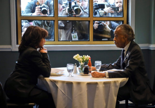 Photo: Bebeto Matthews/Pool/Getty Images. Media members photograph U.S. Senator Kamala Harris, a Democratic presidential candidate, and the Rev. Al Sharpton as they have lunch at Sylvia's Restaurant in New York. February 21, 2019.