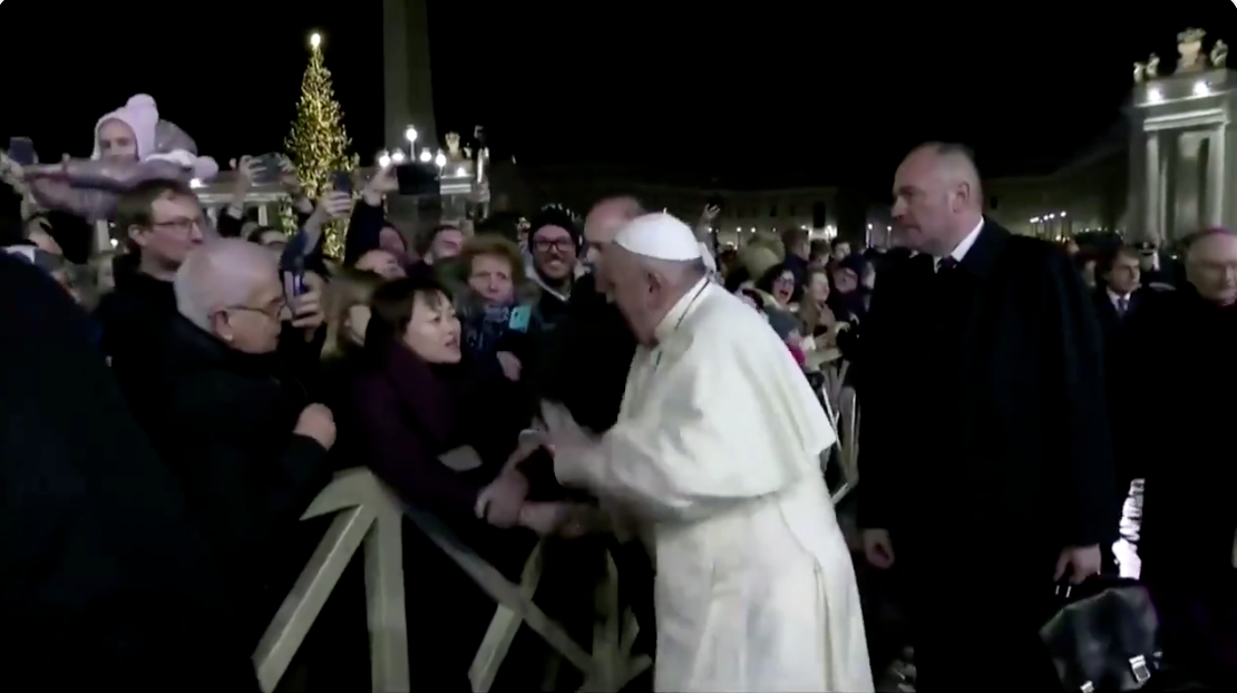 In this still frame from a video, Pope Francis slaps the hand of a woman to free himself after she forcibly grabbed the pontiff and pulled him toward her during a New Year's Eve event in St. Peter’s Square, Dec. 31, 2019.In this still frame from a video, Pope Francis slaps the hand of a woman to free himself after she forcibly grabbed the pontiff and pulled him toward her during a New Year's Eve event in St. Peter’s Square, Dec. 31, 2019. Vatican TV