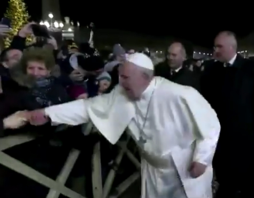 In this still frame from a video, Pope Francis slaps the hand of a woman to free himself after she forcibly grabbed the pontiff and pulled him toward her during a New Year's Eve event in St. Peter’s Square, Dec. 31, 2019.In this still frame from a video, Pope Francis slaps the hand of a woman to free himself after she forcibly grabbed the pontiff and pulled him toward her during a New Year's Eve event in St. Peter’s Square, Dec. 31, 2019. Vatican TV