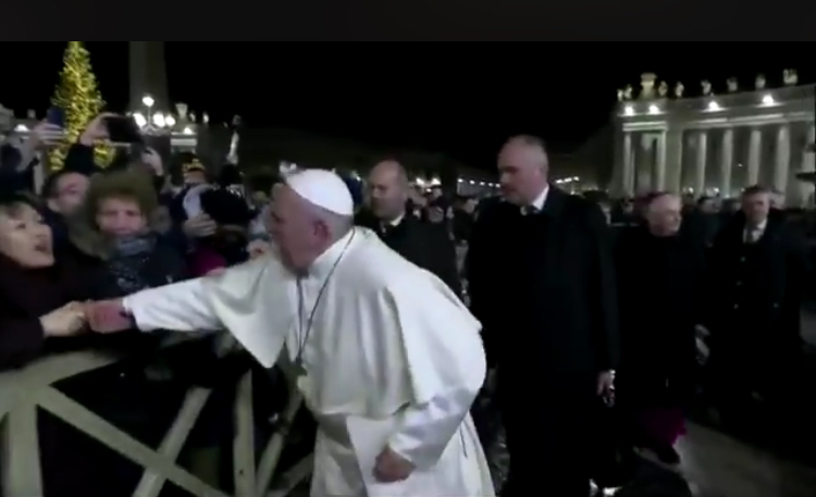 In this still frame from a video, Pope Francis slaps the hand of a woman to free himself after she forcibly grabbed the pontiff and pulled him toward her during a New Year's Eve event in St. Peter’s Square, Dec. 31, 2019.In this still frame from a video, Pope Francis slaps the hand of a woman to free himself after she forcibly grabbed the pontiff and pulled him toward her during a New Year's Eve event in St. Peter’s Square, Dec. 31, 2019. Vatican TV
