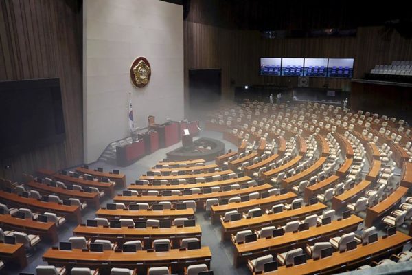 Employees from a disinfection service company sanitize the National Assembly in Seoul, South Korea, February 25, 2020. Photo: Yonhap via Reuters