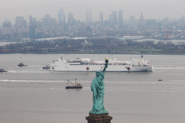 USNS Comfort passes the Statue of Liberty as it enters New York Harbor. (Photo: Mike Segar/Reuters)