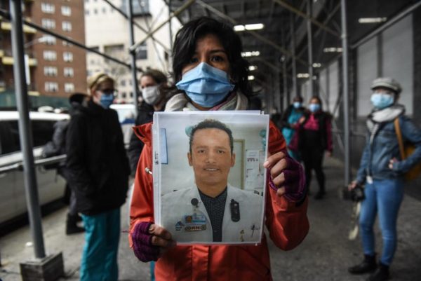  Mt. Sinai medical workers hold up photos of medical workers who have died from the coronavirus during a protest on April 3, 2020 in New York City. Medical workers are protesting the lack of personal protective equipment during a surge in coronavirus cases. (Photo by Stephanie Keith/Getty Images)