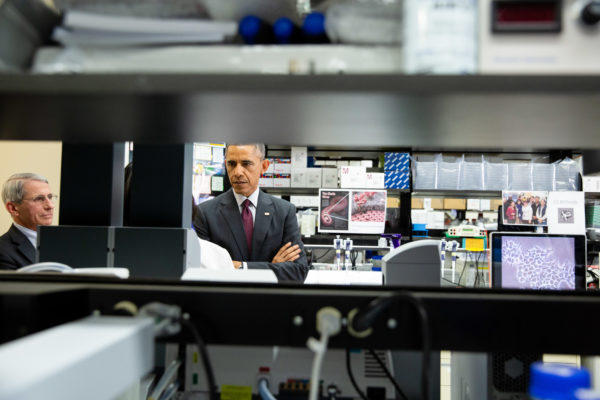 President Barack Obama tours a lab at the Vaccine Research Center at the National Institutes of Health in Bethesda, Maryland, Dec. 2, 2014. Dr. Nancy Sullivan, Senior Investigator, Chief Biodefense Research Section leads a tour of lab activities that led to the Ebola vaccine. (Official White House Photo by Pete Souza)