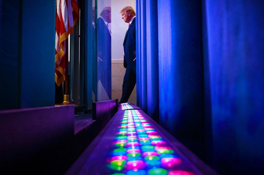 Photo: Tom Brenner/REUTERS Donald Trump is seen from behind the backdrop of the Brady press briefing room as he arrives to lead the daily corona virus response briefing at the White House. 