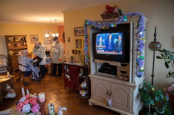 Photo: John Moore for Getty Images. This photo shows Stamford EMS medics wearing personal protective equipment (PPE), check a woman in her apartment for COVID-19 symptoms during a televised Presidential press conference on April 02, 2020 in Stamford, Connecticut. The medics came after she fell down and could not get up, but she showed no signs of coronavirus. Stamford, located close to New York City, now has more than 1,000 confirmed coronavirus cases, the most of any city in Connecticut. The majority of Stamford EMS calls are now for coronavirus patients.