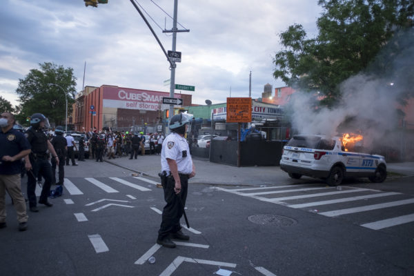 Brooklyn, New York May 30, 2020 The killing in Minneapolis, MN of George Floyd, who was black, by a white police officer last week has touched off nationwide protests. Several hundred demonstrators and police clashed for hours on Saturday evening in the Flatbush neighborhood of Brooklyn, along Bedford and Church Avenues. At least two police cars and several garbage dumpsters were burned and dozens of pepper spray use incidents and arrests ensued. Photograph by ALAN CHIN