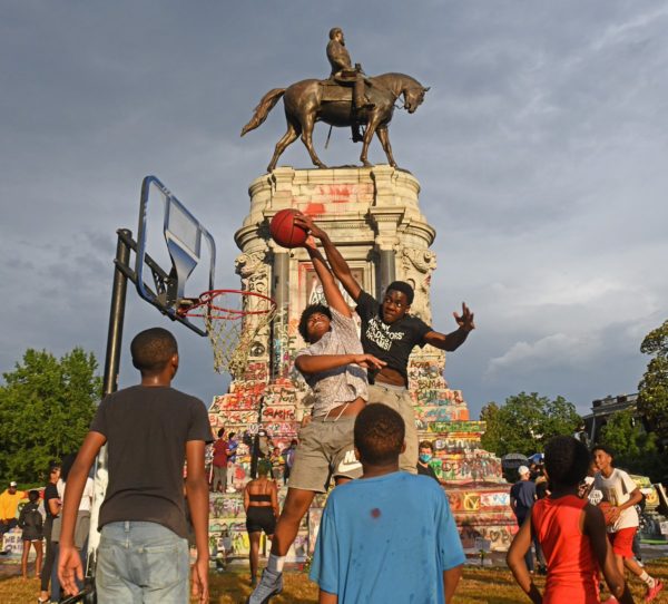 Boys play basketball on a makeshift court at the Robert E. Lee Monument. Photo by Scott Elmquist. June 20, 2020