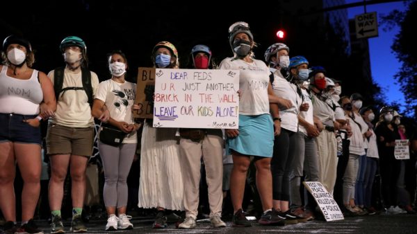 Mothers participate in a demonstration outside the Justice Center during a protest against racial inequality in Portland, Oregon, July 18. REUTERS/Caitlin Ochs