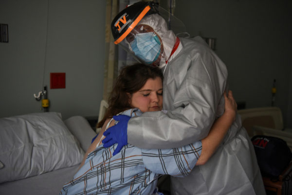 Photo: Callaghan O'Hare/Reuters. Dr. Joseph Varon, 58, the chief medical officer at United Memorial Medical Center, hugs Christina Mathers, 43, a nurse from his team who became infected with COVID-19 at UMMC during the coronavirus outbreak, in Houston, Texas, on July 25, 2020.