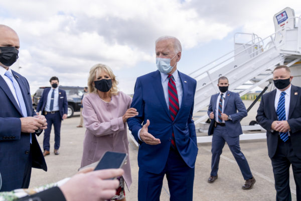 Photo: Andrew Harnik / AP Jill Biden pulls back her husband, the Democratic presidential candidate and former Vice President Joe Biden, distancing him from members of the media as he speaks outside his campaign plane at New Castle Airport in New Castle, Delaware, on October 5, 2020.