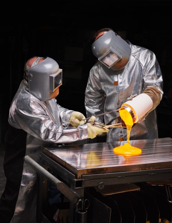 Photo: Christopher Payne/At the Sullivan Park lab, engineers pour molten glass onto a stainless-steel tabletop to cool, so that it can be cut into pieces for tests. Glass used to store vaccines must prove highly stable and chemically inert.The New Yorker