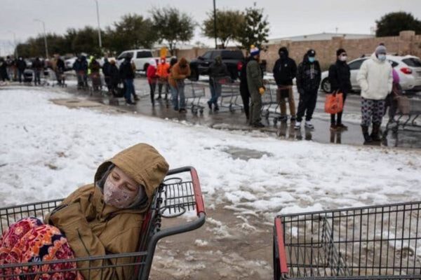 Photo: Tamir Kalifa/The New York Times. Caption: A line of people waited to enter a grocery store in Austin, Texas, on Tuesday, February 16, 2021.