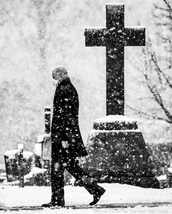 President Joe Biden walks through the snow following Sunday mass at St. Joseph on the Brandywine Catholic Church in Wilmington, DE on February 7, 2021.