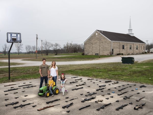 An American family poses with their guns.