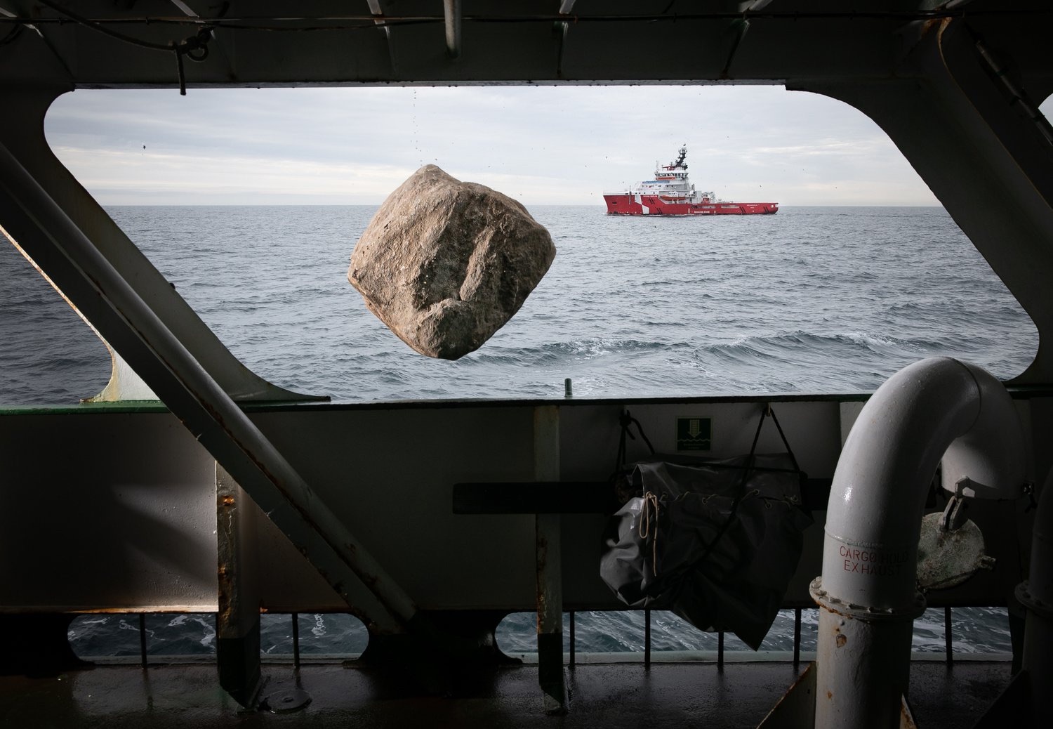 Chatting the Pictures: Greenpeace Boulder Suspended Over the North Sea