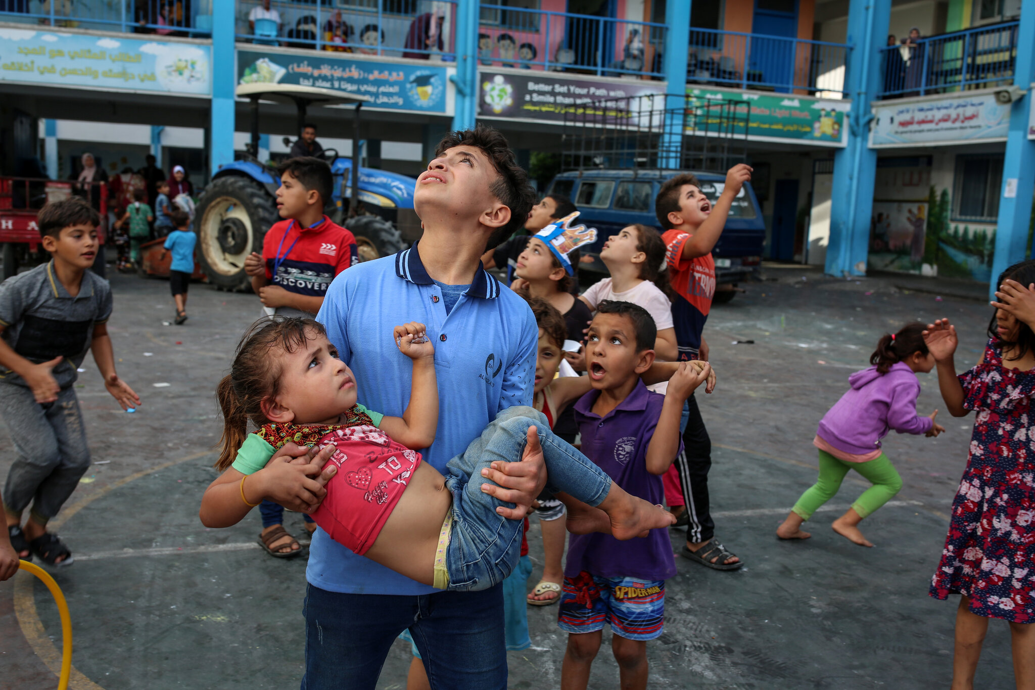 Chatting the Pictures: On a Gaza Playground, Seized by the Peril of Fighter Jets