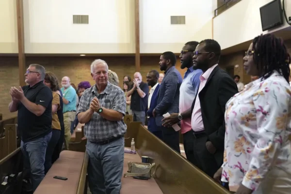 Central Christian Church congregants stand to applaud members of the Haitian community during service on Sunday, Sept. 15, 2024, in Springfield, Ohio. Photo: Jessie Wardarski/AP.